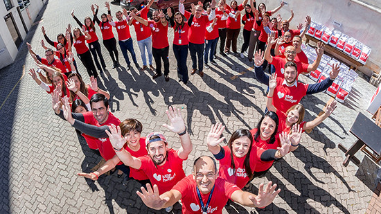 Group of Stop Hunger volunteers, cheering