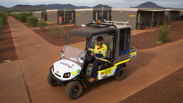 person in sodexo uniform driving buggy