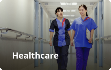 Two nurses walking down a hospital corridor. Text over image says: Healthcare