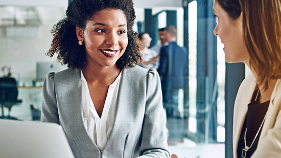 Female co-workers talking